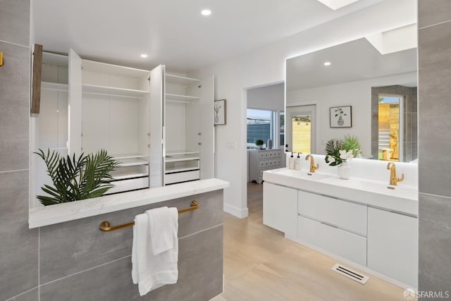 bathroom featuring vanity and hardwood / wood-style floors