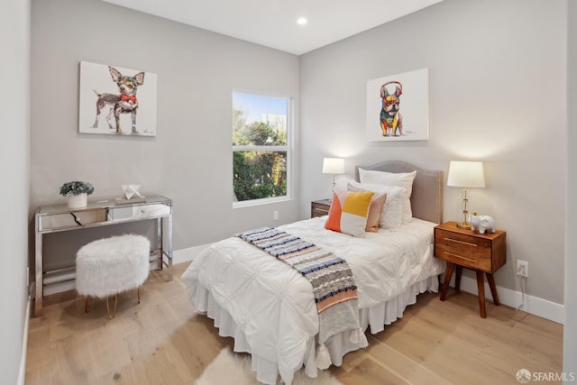 bedroom with light wood-type flooring