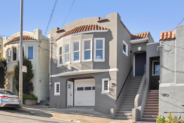 mediterranean / spanish-style house featuring a garage