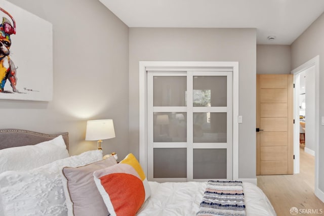 bedroom featuring light hardwood / wood-style floors