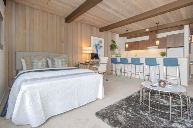 carpeted bedroom with beam ceiling, wood ceiling, and wood walls