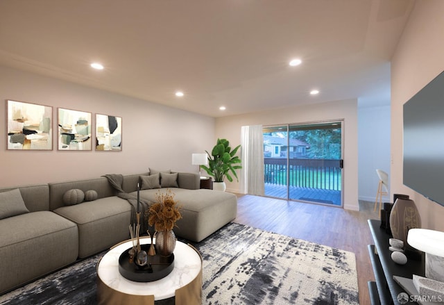 living area with baseboards, wood finished floors, and recessed lighting