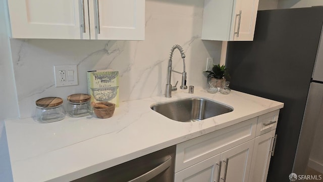 505 Cypress Point Dr Unit 40, Mountain View, CA 94043 - kitchen with a sink, white cabinets, stainless steel appliances, and light stone countertops