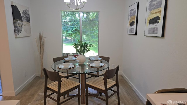 505 Cypress Point Dr Unit 40, Mountain View, CA 94043 - dining area with wood finished floors, a chandelier, and baseboards