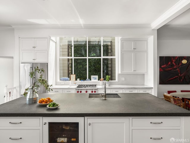 1850 Laguna St, San Francisco, CA 94115 - kitchen with beverage cooler, a sink, crown molding, dark countertops, and white cabinets
