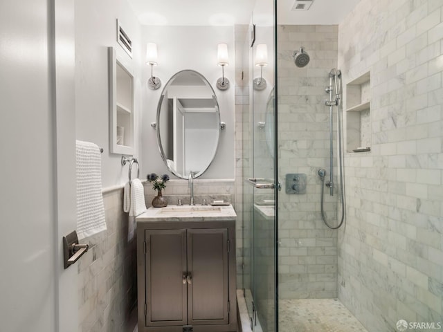 1850 Laguna St, San Francisco, CA 94115 - full bathroom with tile walls, a stall shower, vanity, and a wainscoted wall