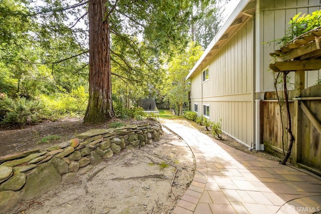 view of yard featuring a patio area and fence