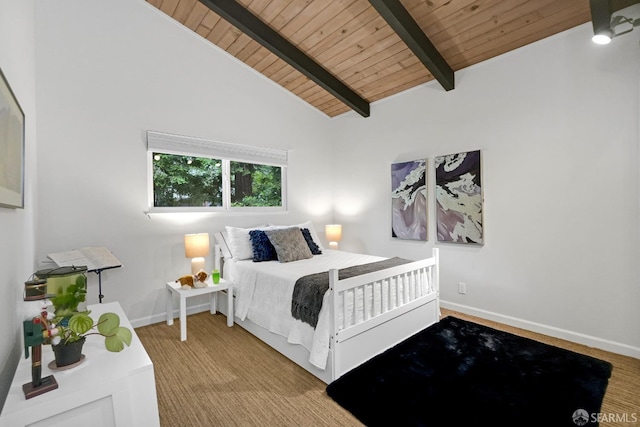 carpeted bedroom featuring baseboards, wooden ceiling, and lofted ceiling with beams