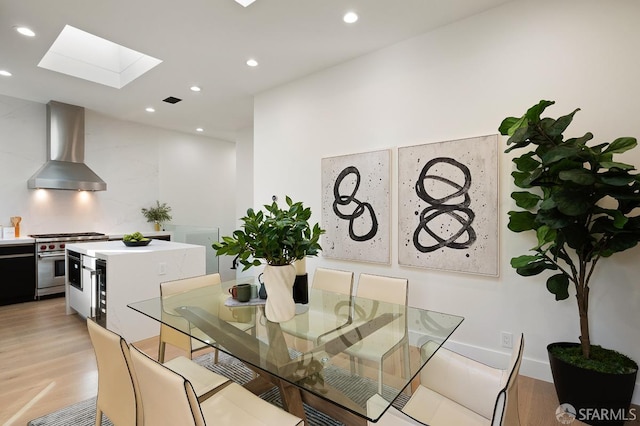 1935-1937 Greenwich St, San Francisco, CA 94123 - dining area with light wood-type flooring, a skylight, visible vents, and recessed lighting