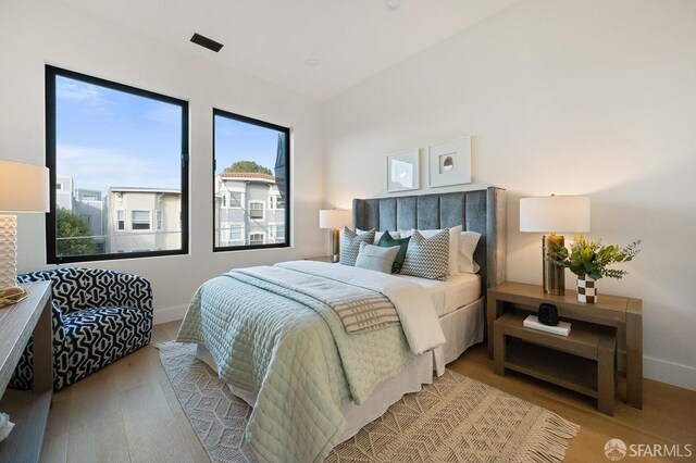 1935-1937 Greenwich St, San Francisco, CA 94123 - bedroom with light wood-type flooring and baseboards