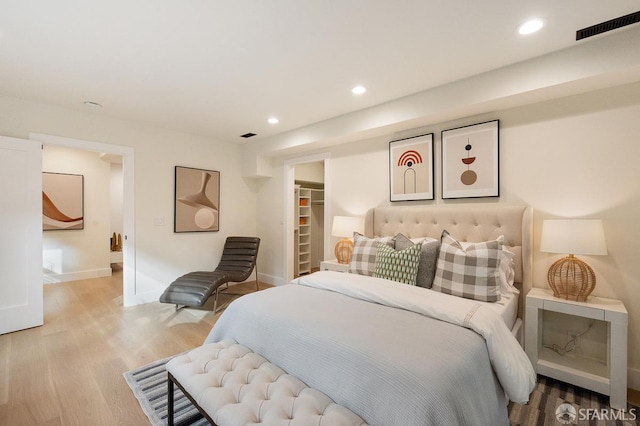 1935-1937 Greenwich St, San Francisco, CA 94123 - bedroom featuring light wood-style flooring, a walk in closet, visible vents, and recessed lighting