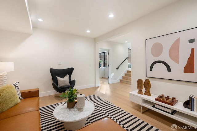 1935-1937 Greenwich St, San Francisco, CA 94123 - living room with light wood finished floors, stairs, baseboards, and recessed lighting