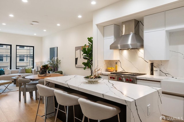 1935-1937 Greenwich St, San Francisco, CA 94123 - kitchen featuring tasteful backsplash, wall chimney exhaust hood, modern cabinets, white cabinetry, and recessed lighting