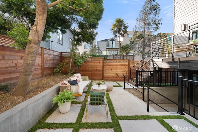 1935-1937 Greenwich St, San Francisco, CA 94123 - view of patio with outdoor lounge area and a fenced backyard