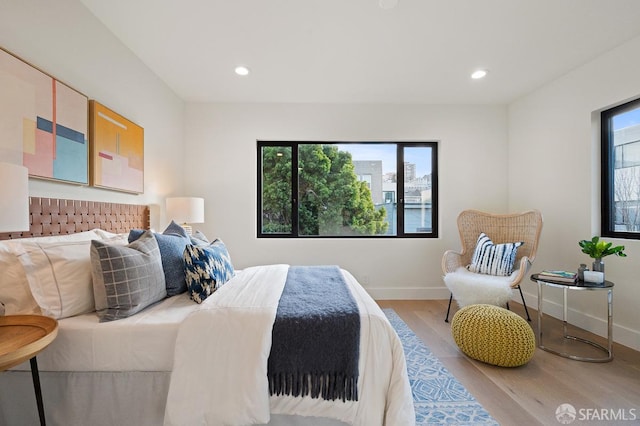 1935-1937 Greenwich St, San Francisco, CA 94123 - bedroom with light wood-style floors, multiple windows, and recessed lighting