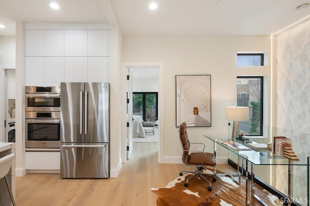 1935-1937 Greenwich St, San Francisco, CA 94123 - kitchen featuring recessed lighting, stainless steel appliances, white cabinetry, light wood finished floors, and modern cabinets