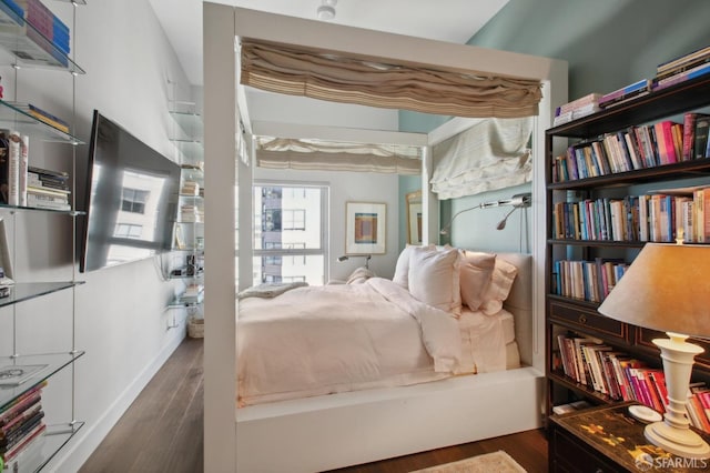 bedroom featuring dark wood-type flooring