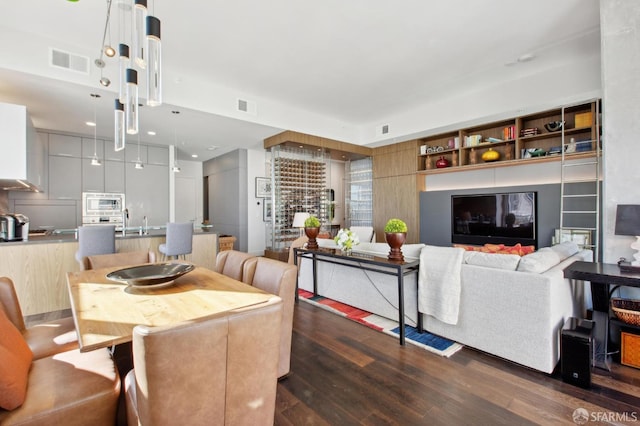 dining space with dark hardwood / wood-style flooring