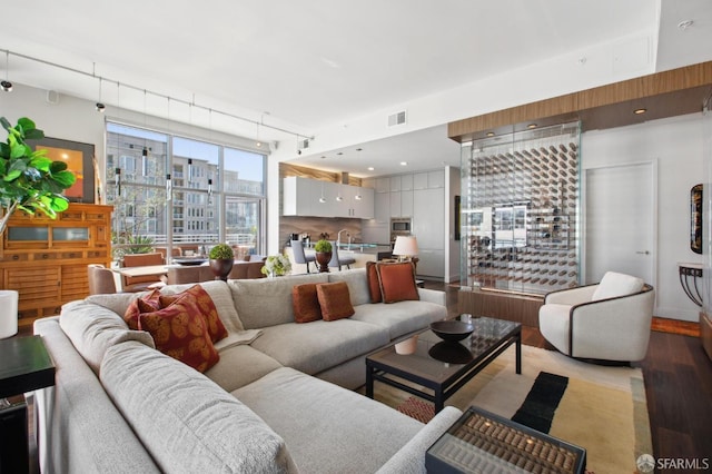 living room with light hardwood / wood-style flooring and sink