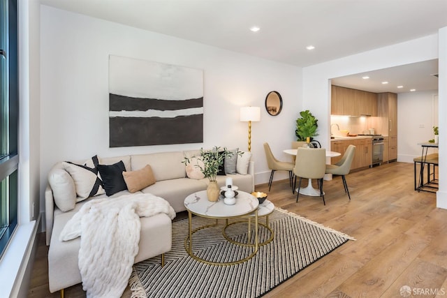 1288 Howard St Unit 418, San Francisco, CA 94103 - living area featuring light wood-style floors, recessed lighting, and baseboards