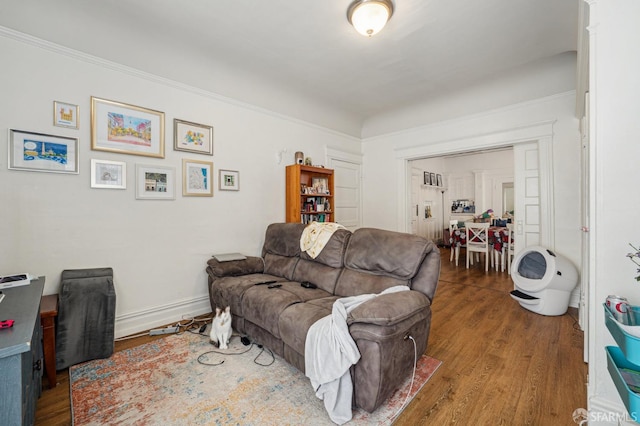 living room with baseboards and wood finished floors