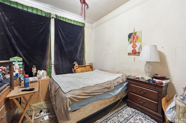 bedroom with ornamental molding