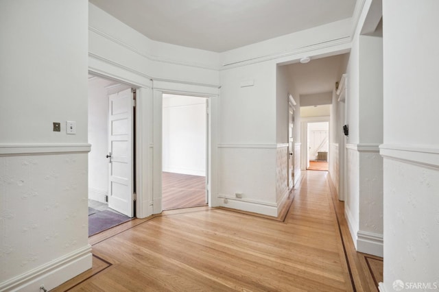 corridor with light wood finished floors