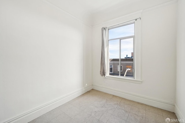 empty room with light floors and baseboards