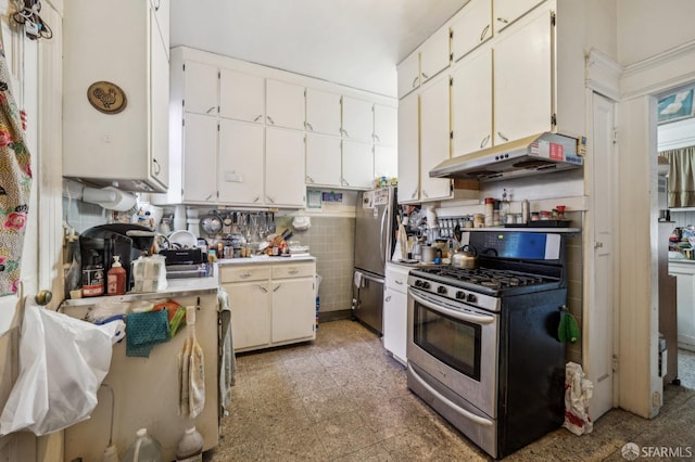 kitchen featuring light floors, light countertops, appliances with stainless steel finishes, white cabinetry, and under cabinet range hood