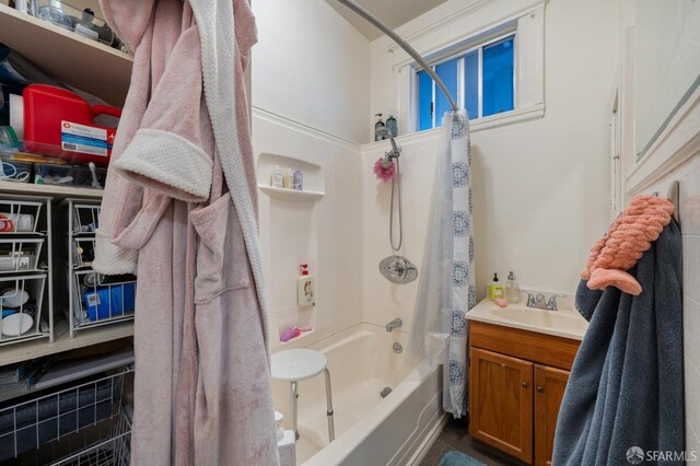 bathroom featuring shower / bathtub combination with curtain and vanity