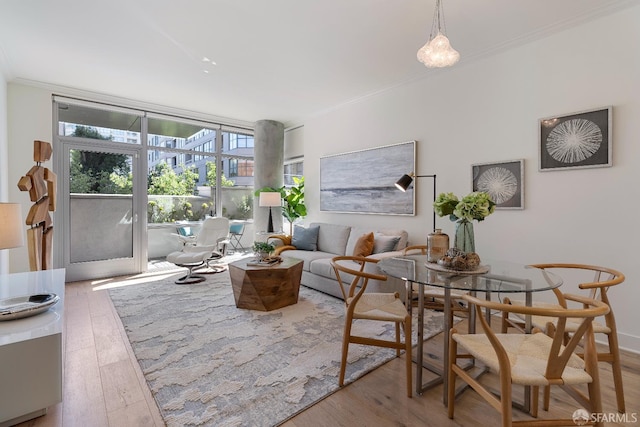 72 Townsend St Unit 302, San Francisco, CA 94107 - living room featuring crown molding, wood finished floors, and a wall of windows