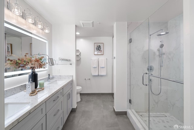 72 Townsend St Unit 302, San Francisco, CA 94107 - bathroom with baseboards, a marble finish shower, double vanity, and toilet