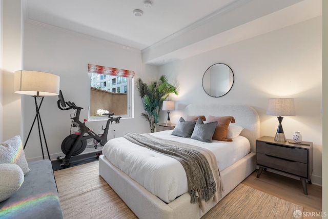 72 Townsend St Unit 302, San Francisco, CA 94107 - bedroom featuring crown molding, wood finished floors, and baseboards
