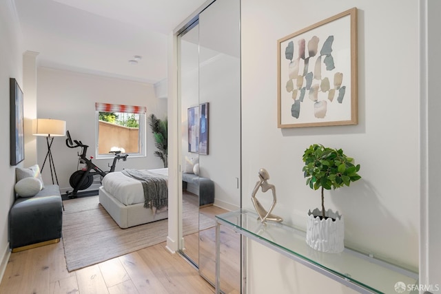 72 Townsend St Unit 302, San Francisco, CA 94107 - bedroom featuring light wood-type flooring, crown molding, and baseboards