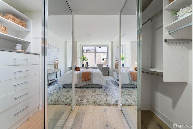 72 Townsend St Unit 302, San Francisco, CA 94107 - bedroom with light wood-style flooring and baseboards