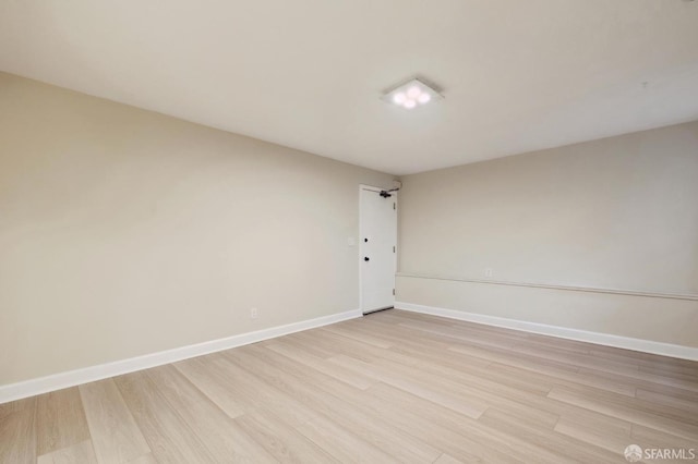 spare room with light wood-type flooring