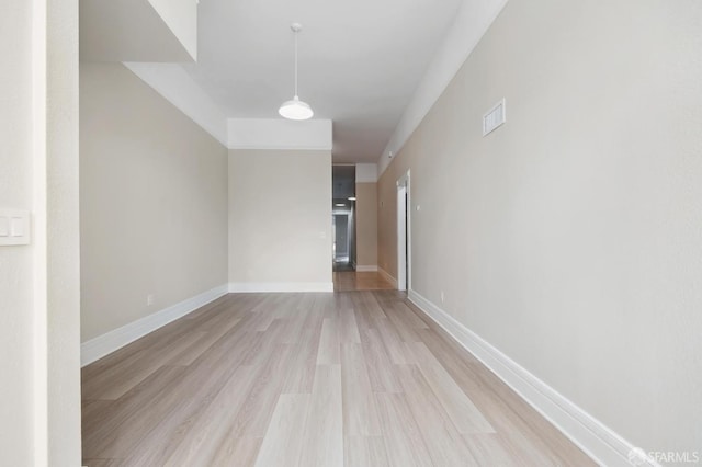 empty room featuring light hardwood / wood-style floors