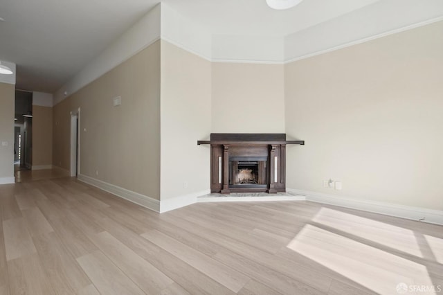 unfurnished living room with light wood-type flooring