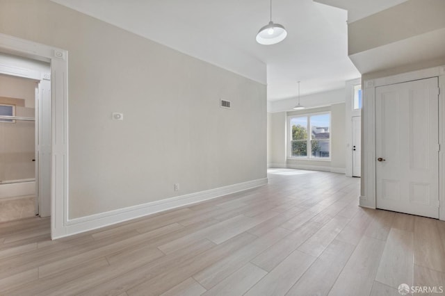 empty room with light hardwood / wood-style floors