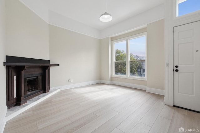 unfurnished living room with light hardwood / wood-style floors