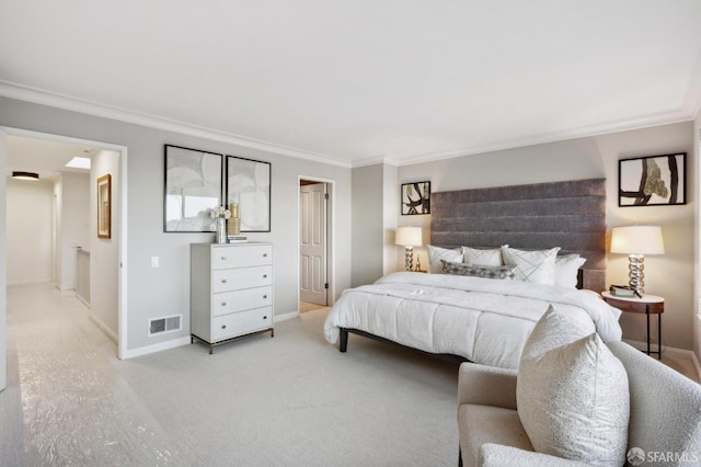 carpeted bedroom with ornamental molding