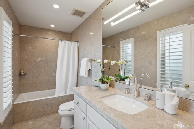 full bathroom with tile patterned flooring, vanity, shower / bath combination with curtain, and toilet