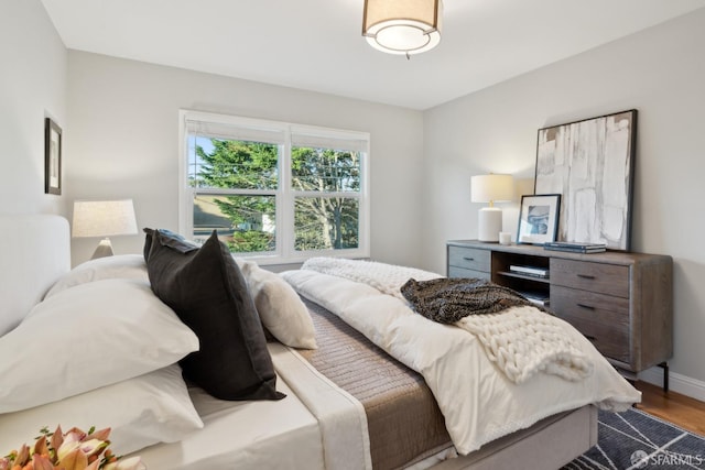 bedroom with wood-type flooring