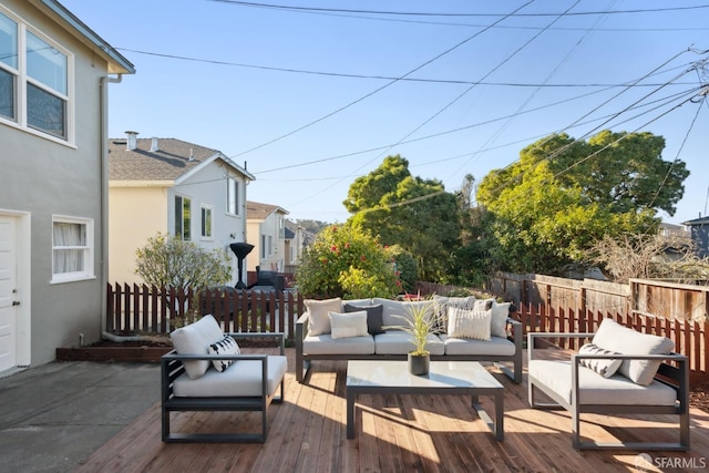 wooden terrace featuring an outdoor hangout area