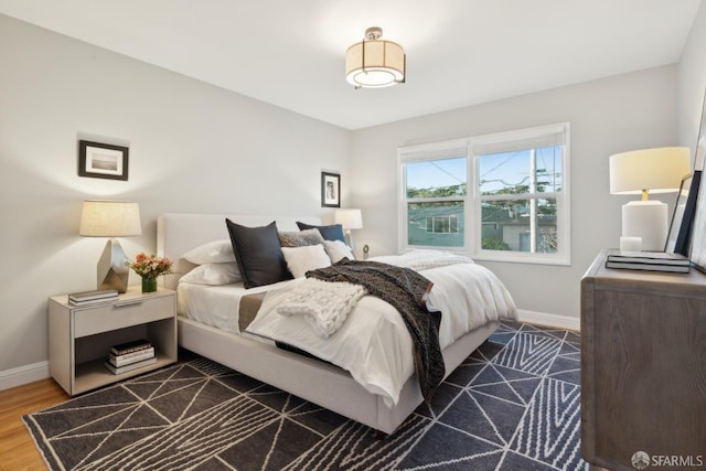 bedroom featuring dark hardwood / wood-style floors