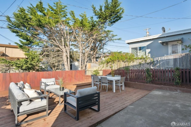 wooden deck with an outdoor living space