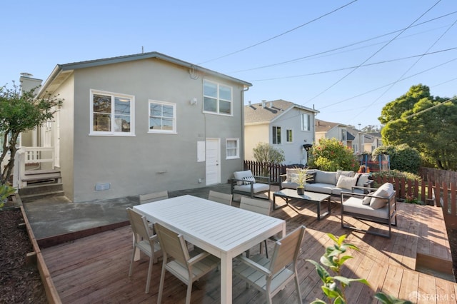 exterior space featuring outdoor lounge area and a deck