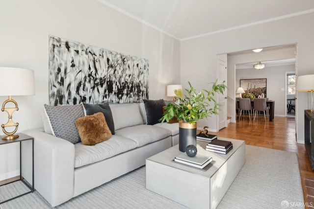 living room with parquet flooring and ornamental molding