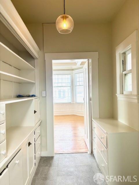 hall with light tile patterned flooring