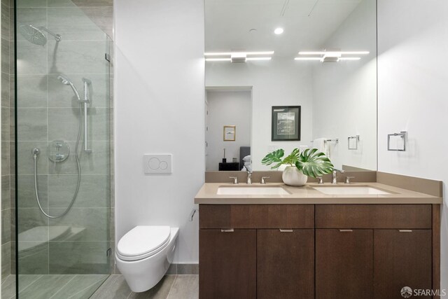 bathroom with toilet, vanity, wood-type flooring, and walk in shower